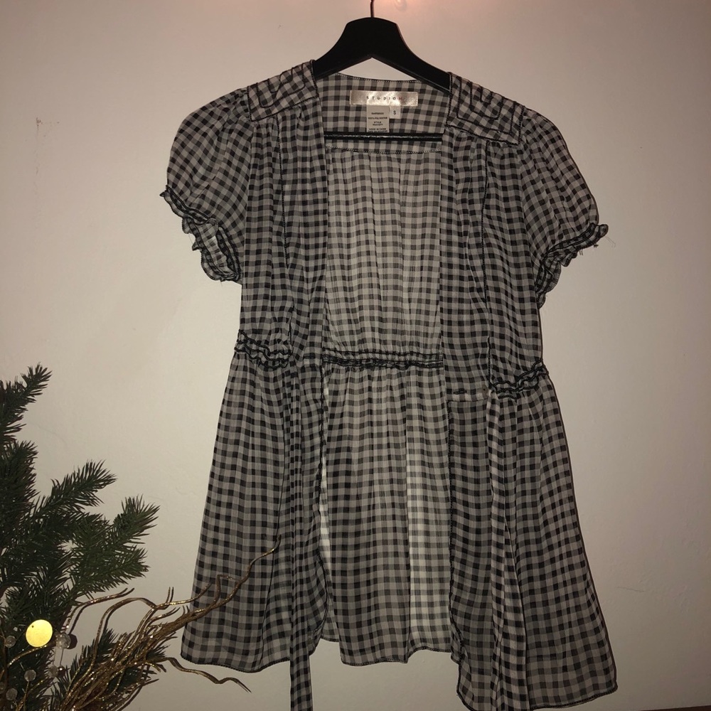 Sheer gray checkered throw on top